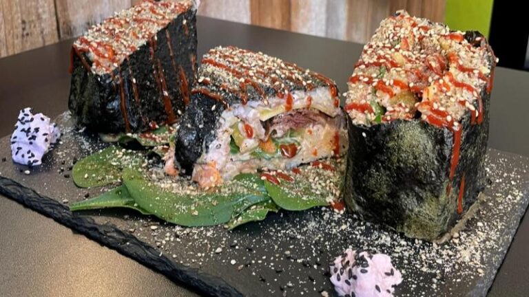 Full-size shot of Sushi Tramezzino with yellow kimchi served on a concrete slab at Vegan Yes in London