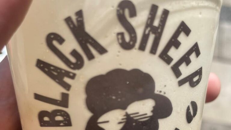 Close-up of the Black Sheep Coffee logo on an Oatly Cold Foam Iced Latte cup