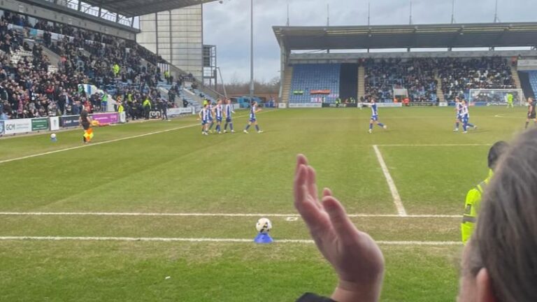 Colchester United players near the touchline during the second half against Barnet
