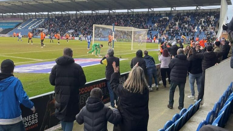 Colchester United supporters celebrating during the 4-1 home win against Barnet