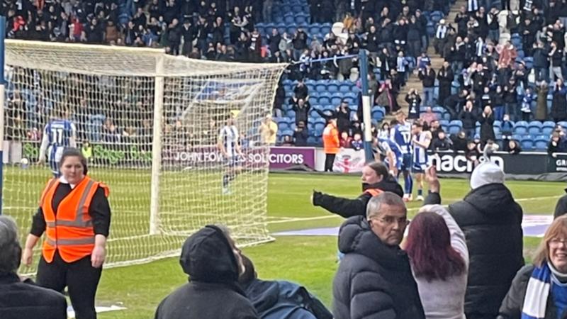 Colchester United fans celebrating during the second half against Barnet at the JobServe Community Stadium