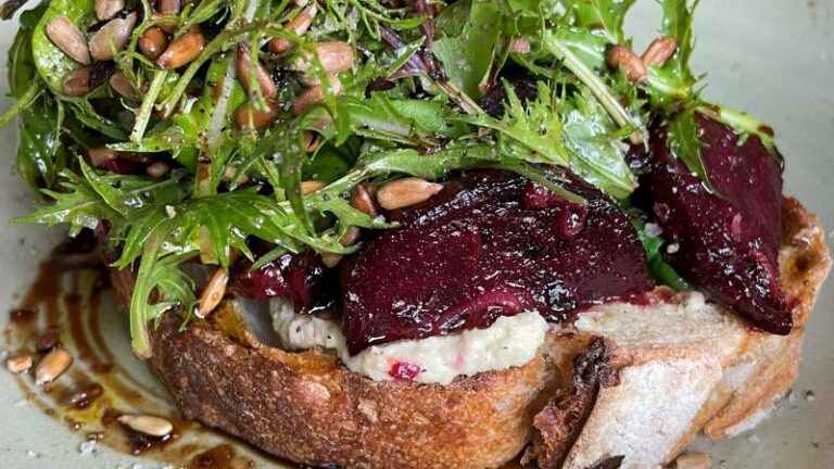 Close-up of the balsamic beetroot and wilted spinach tartine at Cradle in Sudbury