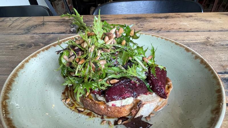 Balsamic beetroot and wilted spinach tartine on sourdough at Cradle in Sudbury