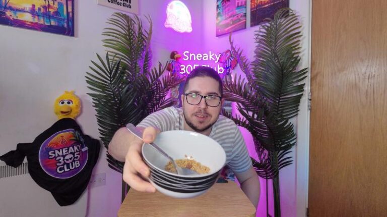 Ian showing a bowl of Deliciously Ella Almond Butter Protein Granola to the camera during his review