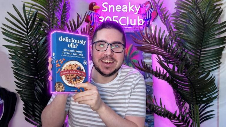 Ian holding the box of Deliciously Ella Almond Butter Protein Granola during his review