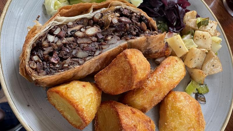 Vegan mushroom and chestnut Wellington with roast potatoes and seasonal vegetables at Donkey and Buskins near Colchester