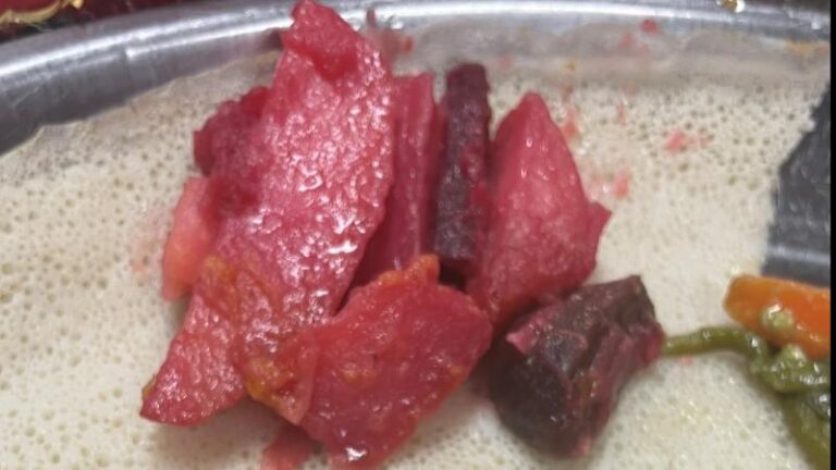 Close-up shot of beetroot on injera bread at Frehiwet Habesha in Sheffield