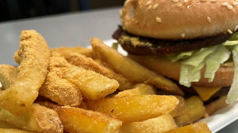 Close-up of The Big Hanks vegan Big Mac-style burger with chips at Hanks Dirty in Colchester