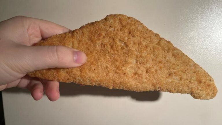 Ian holding a Harry Ramsden’s jumbo fish fillet for a Sneaky305Club review