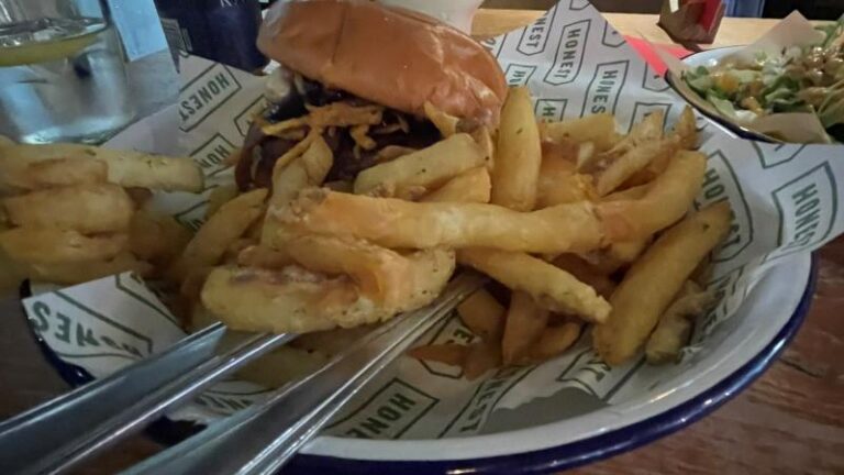 Honest Burgers Vegan Camembert Beyond Christmas Burger served with rosemary fries.