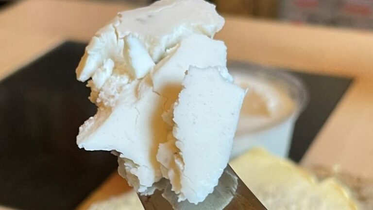 Close-up of Honestly Tasty Garlic and Herb Dip on a knife