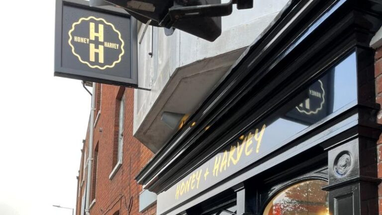Outside sign for Honey + Harvey in Colchester