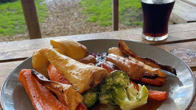 Vegan Sunday roast with vegan sausages, roast potatoes and vegetables at Jacks at Woodlakes near King’s Lynn