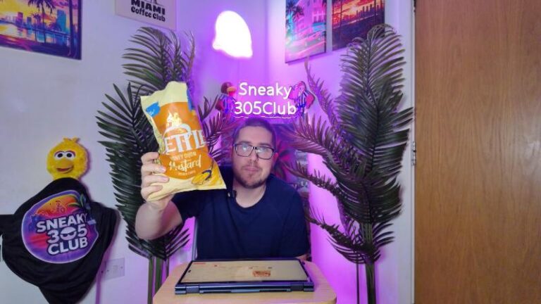 Ian holding a bag of Kettle Honey Dijon Mustard Potato Chips for review
