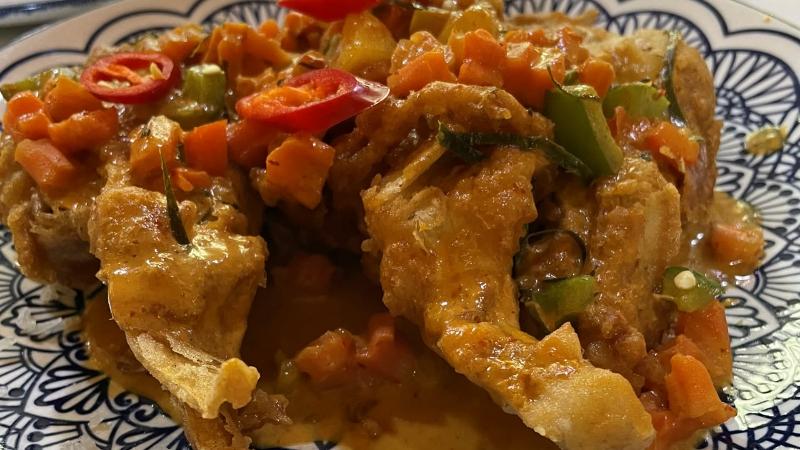 Close-up of crispy tempura banana blossom in red coconut sauce from Lemongrass at The Moor Market in Sheffield
