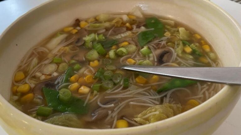 Another close-up of miso sweetcorn chowder at The Commons Cafe in Colchester with spoon in bowl