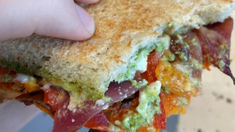 Bite shot of the M&S Very Veggie Toastie showing the Mediterranean-style filling