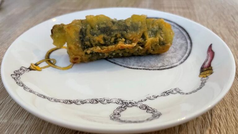 Full-size shot of half-eaten vegan Crispy Seaweed Rolls (Kimmari) at MukBap in London