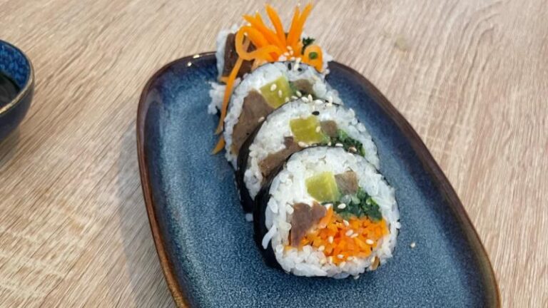 Closer shot of a row of vegan Fat Rolls (KimBap) at MukBap in London