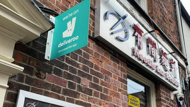 Outside sign for Noodle Inn Centro near West Street in Sheffield