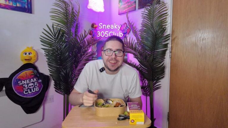Ian smiling at the camera while reviewing the Pollen + Grace Mexican Smoky Chipotle Black Bean Burrito Bowl
