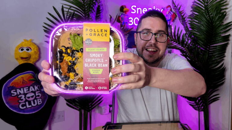 Ian holding the Pollen + Grace Mexican Smoky Chipotle Black Bean Burrito Bowl packaging