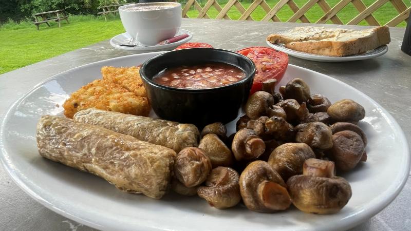 Full plate shot of vegan breakfast with oat milk cappuccino and toast at Shoulder of Mutton near Colchester