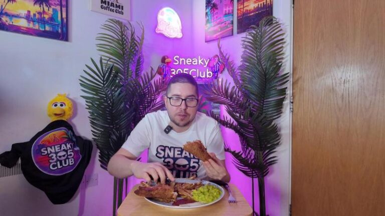 Me looking at a Harry Ramsden’s fish fillet while holding half of it