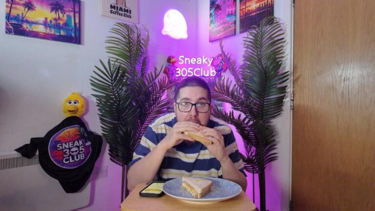 Ian about to bite into the Tesco Beechwood Ham Egg and Chips Sandwich