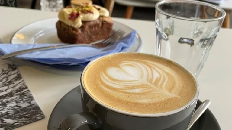 Oat milk flat white with chai cake at The Hop Coffee plant-based cafe in Sheffield