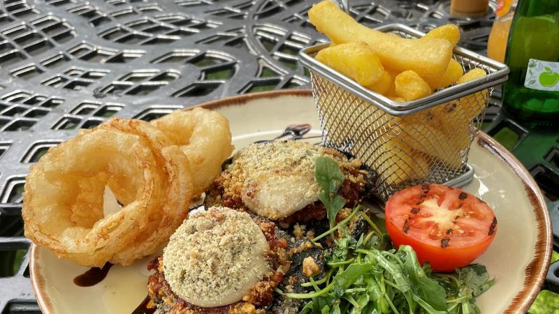 Vegan steak and chips with onion rings and grilled tomato at The Swan in Chappel