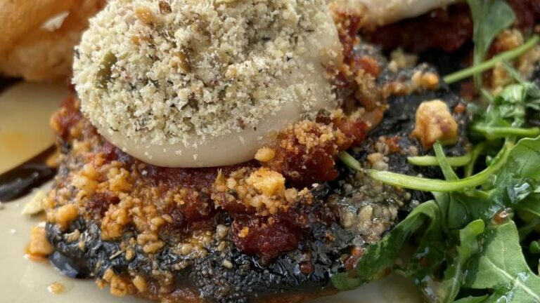 Close-up of the vegan steak with Portobello mushroom, vegan mozzarella and crumble topping at The Swan in Chappel