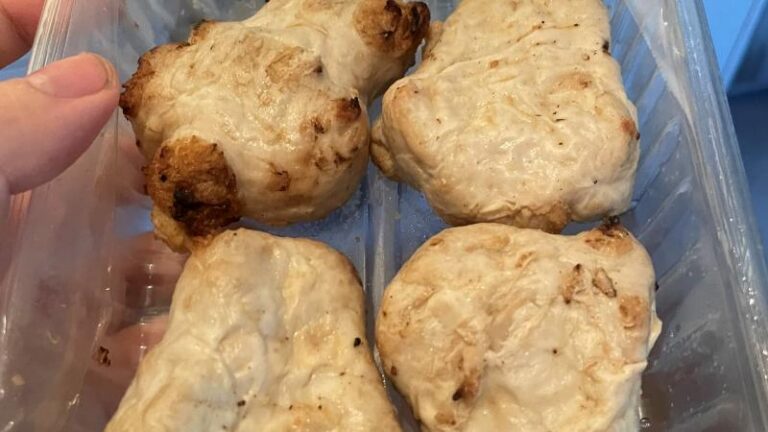 Photo of THIS Isn’t vegan chicken thighs in their casing with the top wrapping removed to show what they look like uncooked
