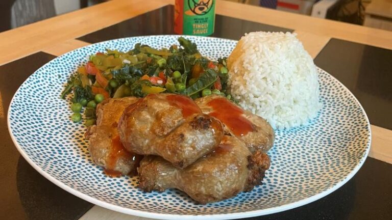 Cooked THIS Isn’t vegan chicken thighs with Tingly Ted sauce, served with peas, kale, peppers and rice