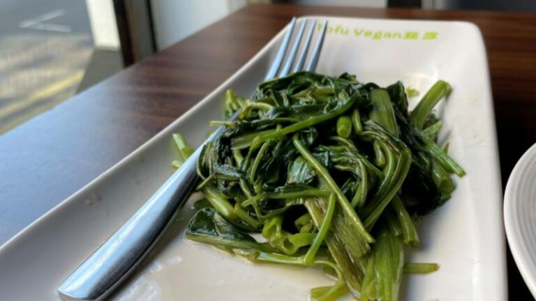 Stir-fried water spinach with chilli and Sichuan pepper served at Tofu Vegan