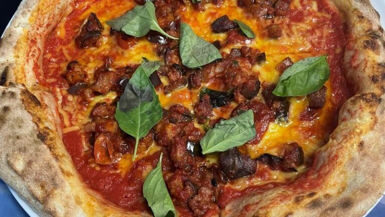 Close-up shot of vegan Neapolitan pizza at UE Paisa in Hillsborough, Sheffield