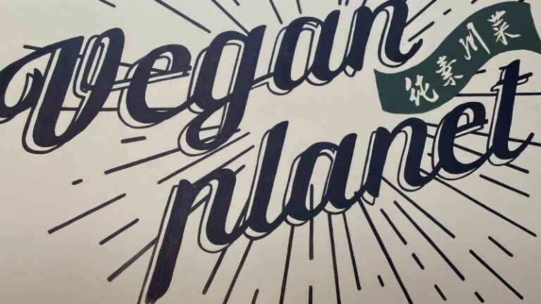 Vegan Planet restaurant logo inside the Camden restaurant in London