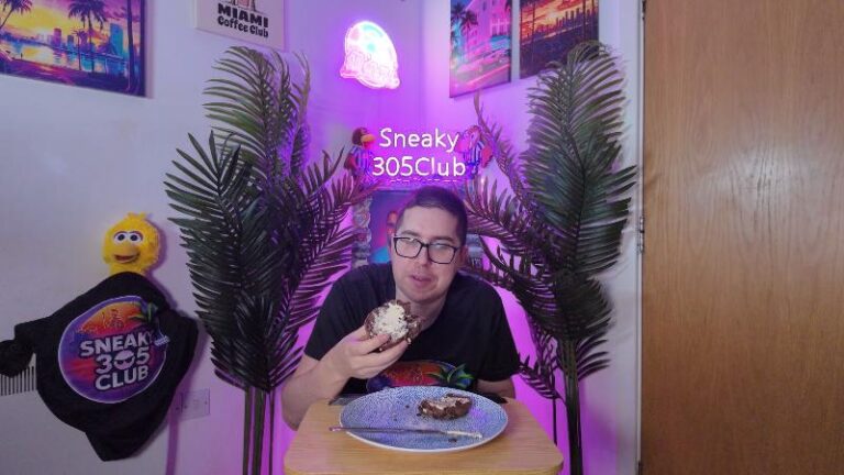 Ian eating a Waitrose No.1 Belgian Chocolate Hot Cross Bun during his review