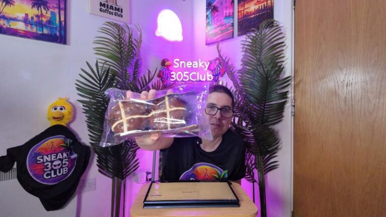 Ian holding the packaged Waitrose No.1 Belgian Chocolate Hot Cross Buns during his review
