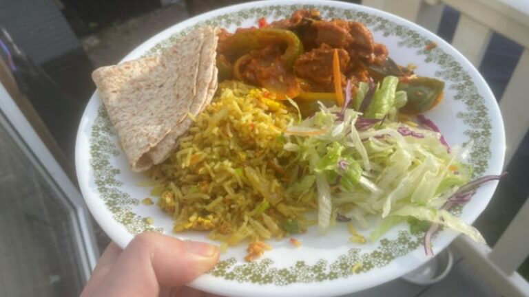 Plate of Jomidar Mahal takeaway curry with special rice, chapati and salad