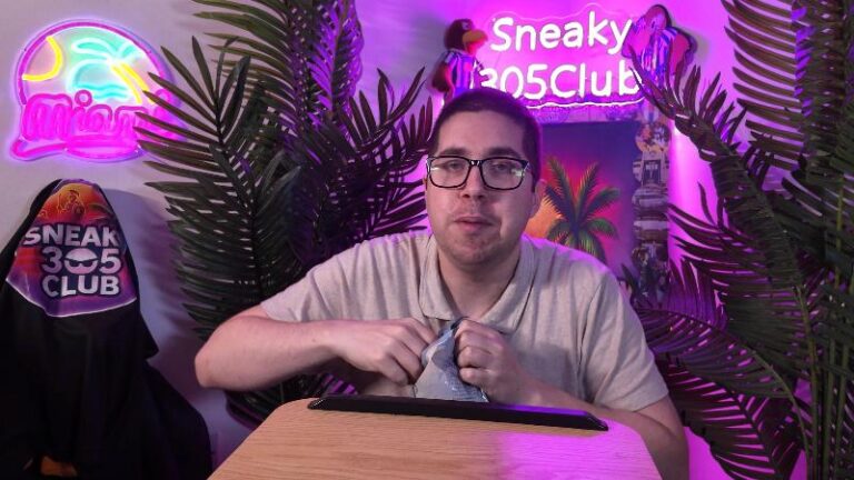 Ian opening the bag of Diddly Squat Farm Mushroom and Wild Garlic Crisps during his review
